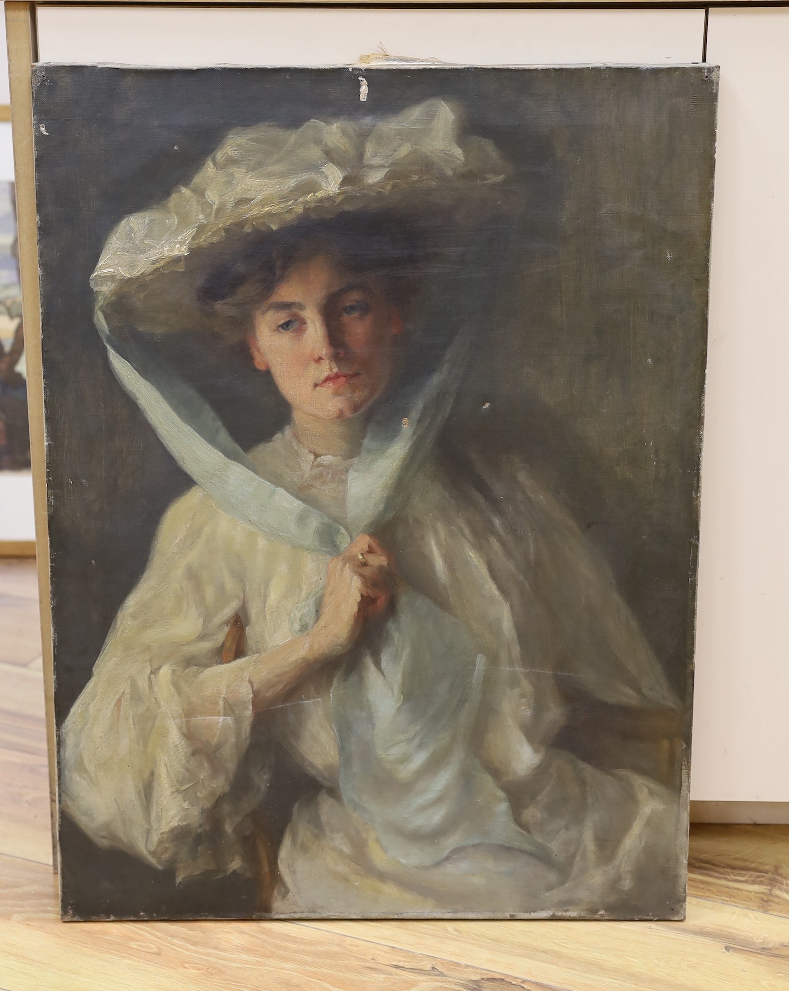 English School c.1910, oil on canvas, Portrait of a lady wearing a white bonnet, 69 x 51cm, unframed